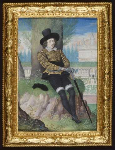 a_young_man_seated_under_a_tree