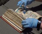 Claire holds Anne Boleyn's books of hours