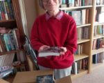 Toni Mount holding her book "The Colour of Bone"