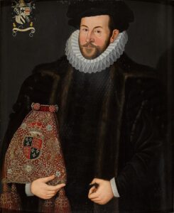 Sir John Puckering, holding the Lord Keeper's Purse embroidered with the royal arms of Queen Elizabeth I.